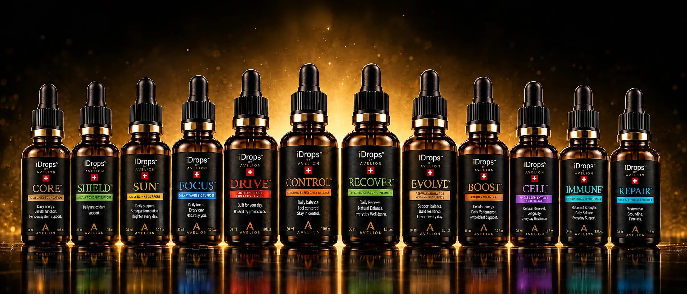 The complete range: twelve iDrops bottles in one arc on black glass.